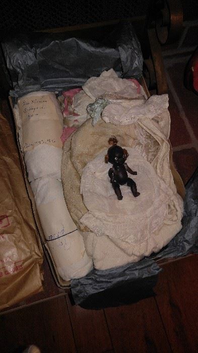 Black Americana bisque baby doll and vintage clothing