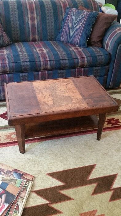 Coffee table with deer motif, room-size area rug--SOLD