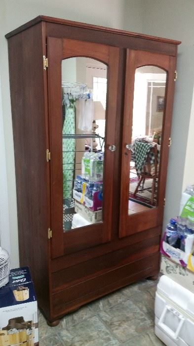 Large clothing armoire with mirrored doors