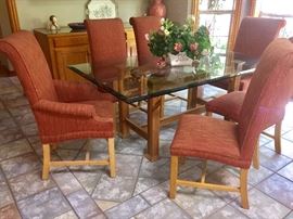 Glass top dining table with 6 parsons chairs