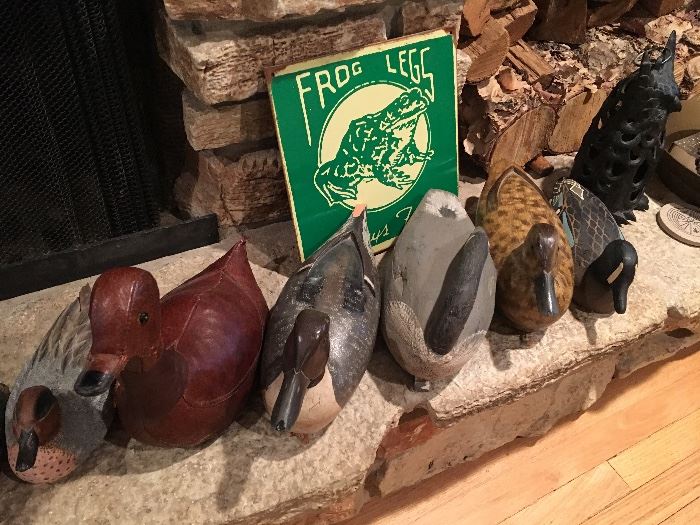 Duck decoys, old metal sign