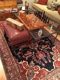 Nice leather ottoman, beautiful hand woven area rug