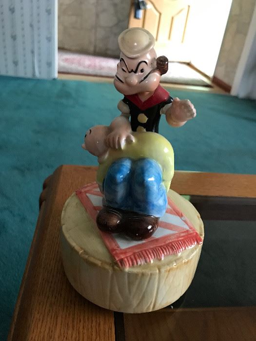 Popeye spanking Swee' Pea.  Music box, 1980 King Features Syndicate, Inc
