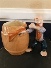 Ceramic man with shotgun to his eye
