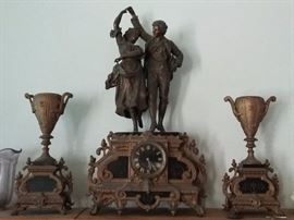 Paris 3-pc set of gilt figural clock with matching pair of urns by Leroy