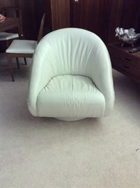 Swivel cream leather club chair