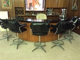 Custom made bar with black leather swivel stools