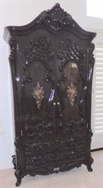 Made in Italy. Deep brown lacquer media cabinet. 82"h, 40"w. $1,500.