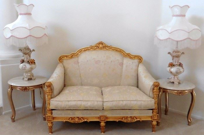 Silik Fine Italian Furniture loveseat framed in carved gilt wood. 51"w, 30 1/2" deep. $1,560. Comparable retail: $4,452. End tables-marble top over gilt wood base, doe feet. 21 1/2" diameter, 22"h. Capodimonte lamps-$250 ea
