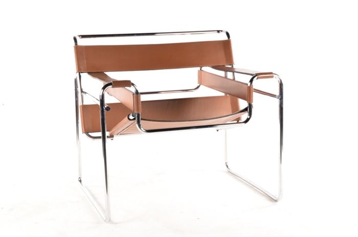 A Knoll Marcel Breuer "Wassily" Mid Century Modern Chair: A Knoll Marcel Breuer “Wassily” Mid Century Modern chair. This brown leather chair in the Bauhaus style after designer Marcel Breuer features a silver tone metal frame and angular seat with armrests and back support.