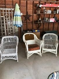 Three vintage wicker chairs -  two rockers; one chair.