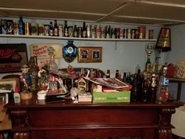 Bar lamps and lights, wall art, signs, and top of home wood bar (I cleaned this off now, lol) 