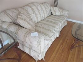 Beautiful fine upholstery material on this 8' couch with two large bench seat cushions and two throw pillows. 