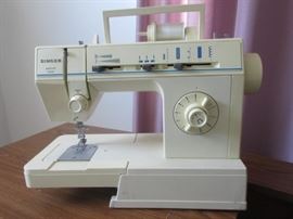 Singer sewing machine with cabinet.