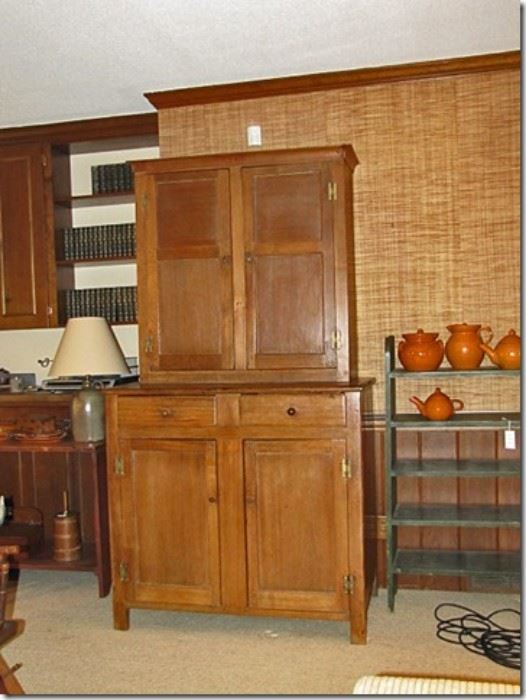 Moravian walnut two piece flat wall cupboard, circa 1820