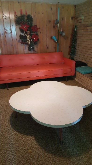 Fantasic Vinyl sofa and formica starburst coffee table!