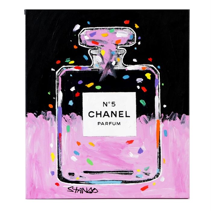 John Stango Mix Media on Canvas of Chanel in Pink: A serigraph with acrylic embellishments of a Chanel bottle in pink by listed Contemporary artist John Stango (b. 1958). This works features a print of a Chanel N°5 perfume bottle. The canvas is painted in pink acrylic along the bottom as well as the upper portion of the bottle. Flecks of acrylic paint in blue, orange, yellow are scattered throughout the composition. This piece is signed in black paint in the lower left corner and to the verso in black ink. To the verso, a horizontal hanging wire is present and this piece comes ready to hang. For a coordinating piece please view item number 16NYC025-171.