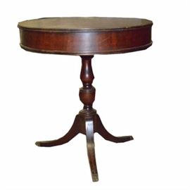 Mahogany Round Table with Drawer by Imperial Furniture: A mahogany round table with drawer by Imperial Furniture. The piece is made is marked 123 Mahogany Association Inc. It has metal claw feet with three legs.