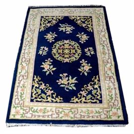 Handwoven Endo Chinese Area Rug: A handwoven Endo Chinese area rug. The rug is 100% wool pile. It is cream with navy ,tan, pink ,green and yellow colors.