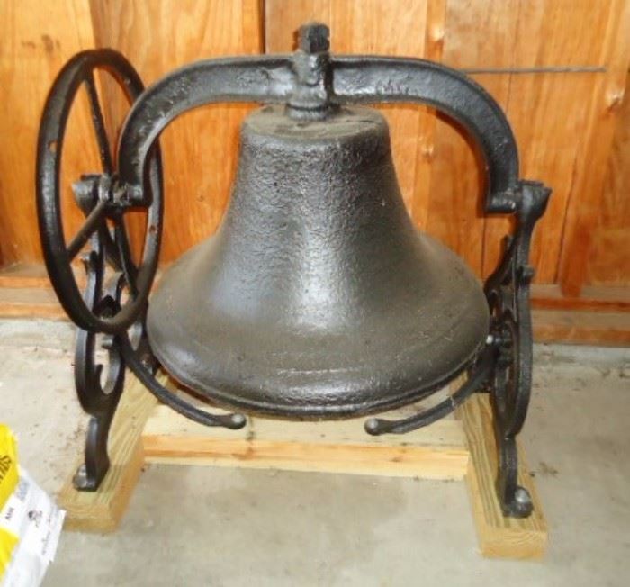 Large Antique bell on wooden stand