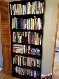 Black Contemporary Bookcase. These are just some of the books. Novels. Mystic, Cookbooks, Coffee Table, Paperbacks. Educational. 