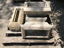 Cut sandstone column bases and limestone planters