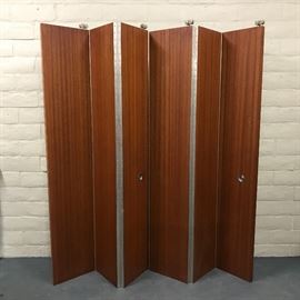 Sections of big bi-fold curtain wall curtain, African stripe mahogany, from Architectural Digest featured home late 60's issue