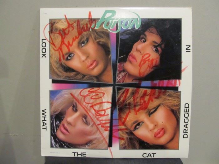 Poison's "Look What the Cat Dragged In" album w/autographed cover.