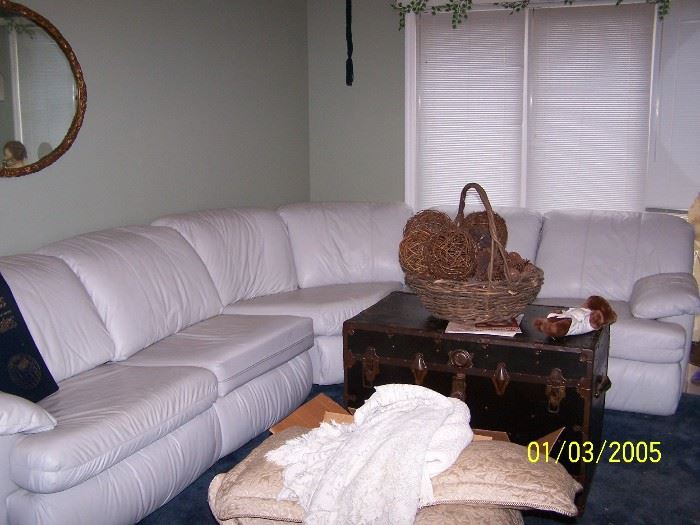 white Leather Sectional Sofa with a Sleeper on one end and Recliner on the other end, by Lane