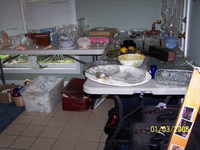 Tables full of Glassware and misc., Suitcases, Oil Lamps, China,  and more
