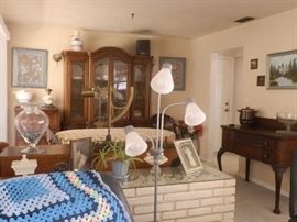 Tall wood buffet and Wood china hutch.  Wood dining set with 4 chairs