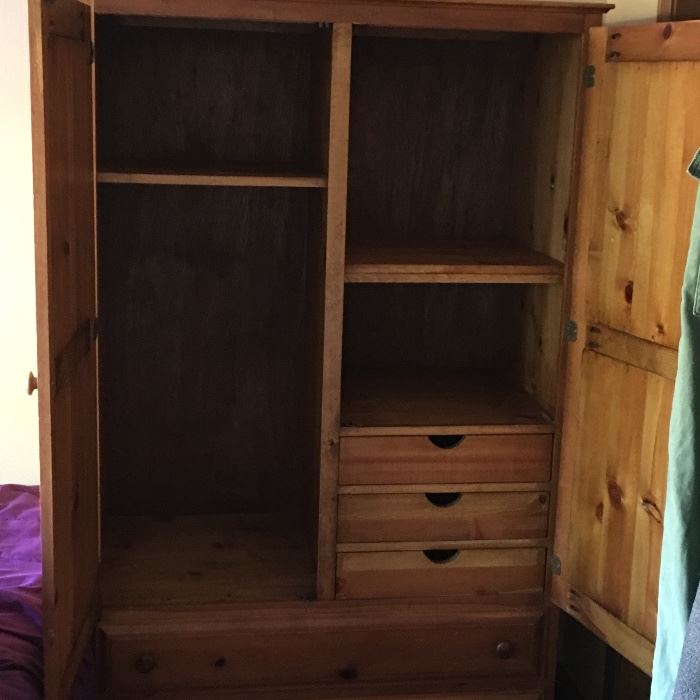  Wardrobe armoire with three drawers and multiple shelves 