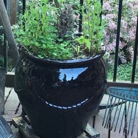 2 matching dark colored ceramic pots