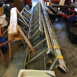 24 foot extension ladder with adjustable legs plus 4 additional ladders 