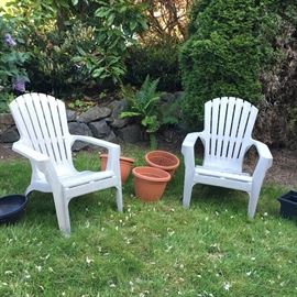  Two plastic Adirondack chairs that we finally got the neighbors out of 