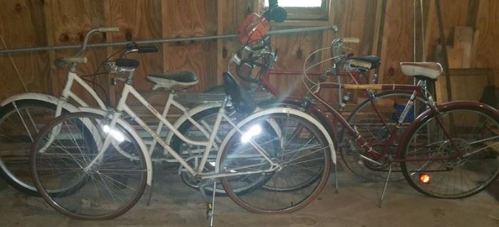 Schwinn Collegiate bike, Monark bike, Huffy Highlander bike, and a Raleigh bike.