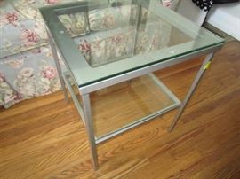 One of many metal and glass tables