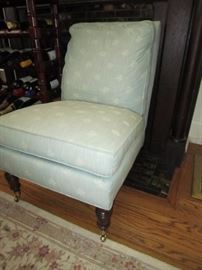 One of a pair of blue slipper chairs