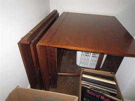 Vintage pair of banquet tables. The one on the left has both leaves down.  The one on the right has only one leaf up.