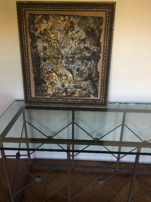 Gorgeous glass topped French console table with a Framed antique Spanish tooled leather piece gorgeous frame one of a kind!
