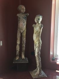 two  2 1/2' tall clay statues stunning by artist Evelyn West of Utah.