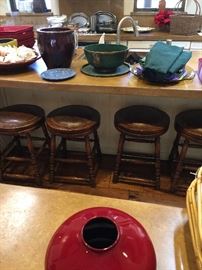 Four antique English leather bar stools