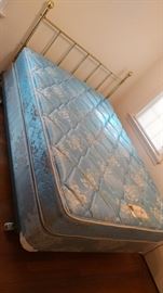 Nice full size mattress & boxspring, along with a simple brass headboard.