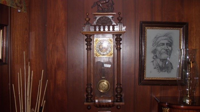 several antique wall clocks