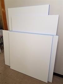 Large primed canvases; the largest is about 46 x 72".