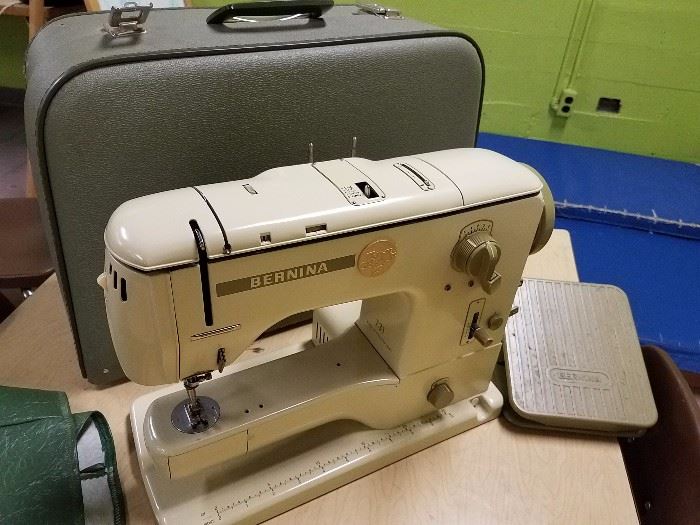Bernina sewing machine. Although it works, this particular machine doesn't fit the listed sewing table well due to the positioning of the power cords.