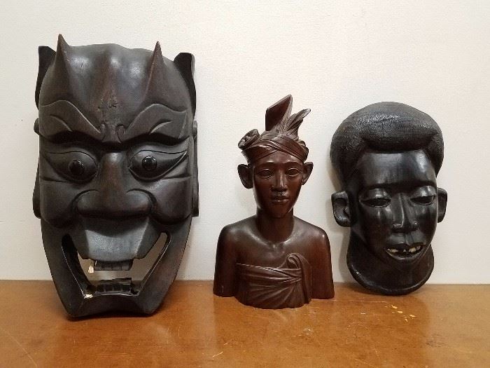 Hand-carved wooden African bust and masks. The larger mask is about 13" tall. 