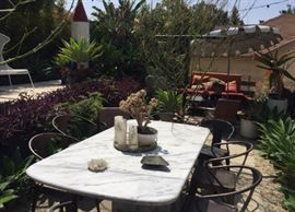 Marble dining outdoor table, various large plants