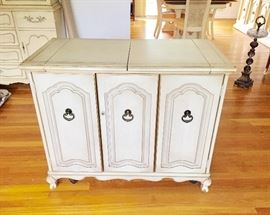 This unique Cabinet is on rolling casters and turns into a bar! It's in perfect shape and very cool! 