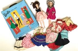 Barbie case with fashion dolls and clothing